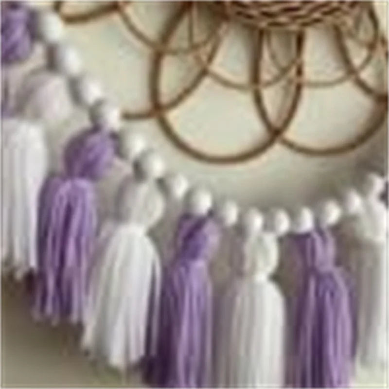 Yellow boho tassel garland wall decor with multiple strands hanging