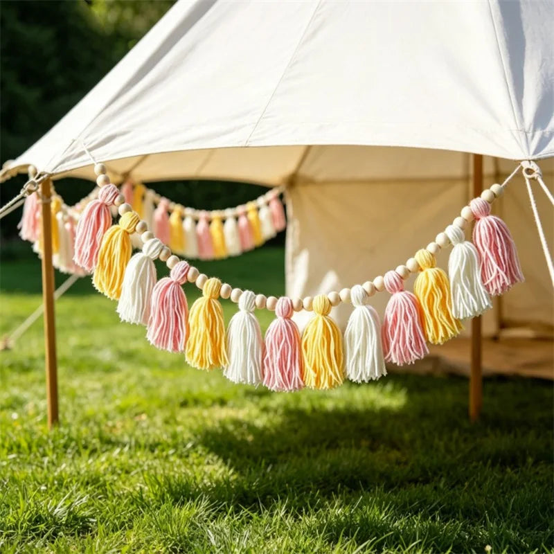 Handmade bohemian tassel banner in pink and yellow colours, perfect for nursery and children's room decoration