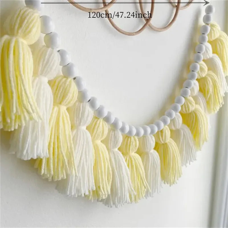 Yellow boho tassel garland wall decor with pom poms