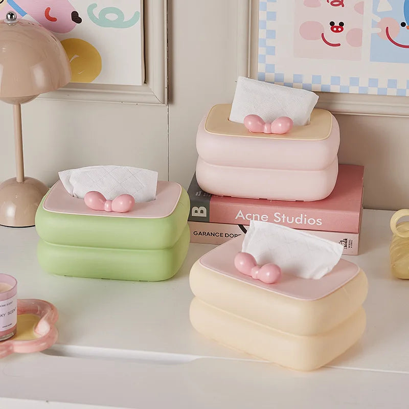 Cute spring-loaded desktop tissue box with large storage capacity.
