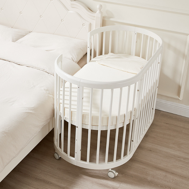 Emerald Round Oval Cot White Including sheets and Snuggletime Mattress